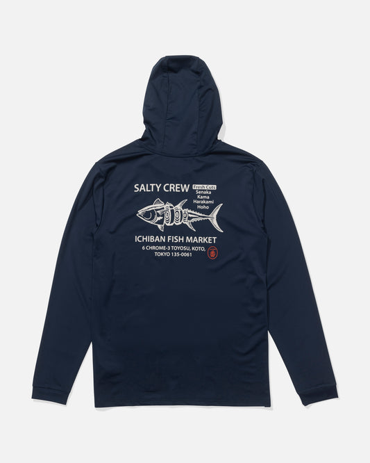 The Salty Crew Fish Market Hood Sunshirt in navy features long sleeves, a fish graphic, Japanese characters, and a Tokyo address on the back. It offers UPF 50+ sun protection—ideal for outdoor days.