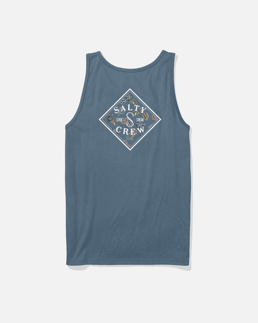The Salty Crew Tippet Fill Tank in Slate is a blue tank top with a back screenprinted diamond-shaped logo featuring ocean graphics and "Sink or Swim" text. Made from soft spun, 100% cotton for all-day comfort.