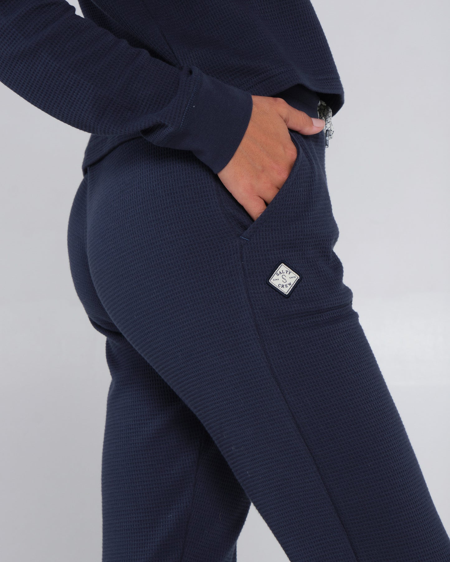 Close up shot of pocket detailing of the Tippet Dark Navy Pant
