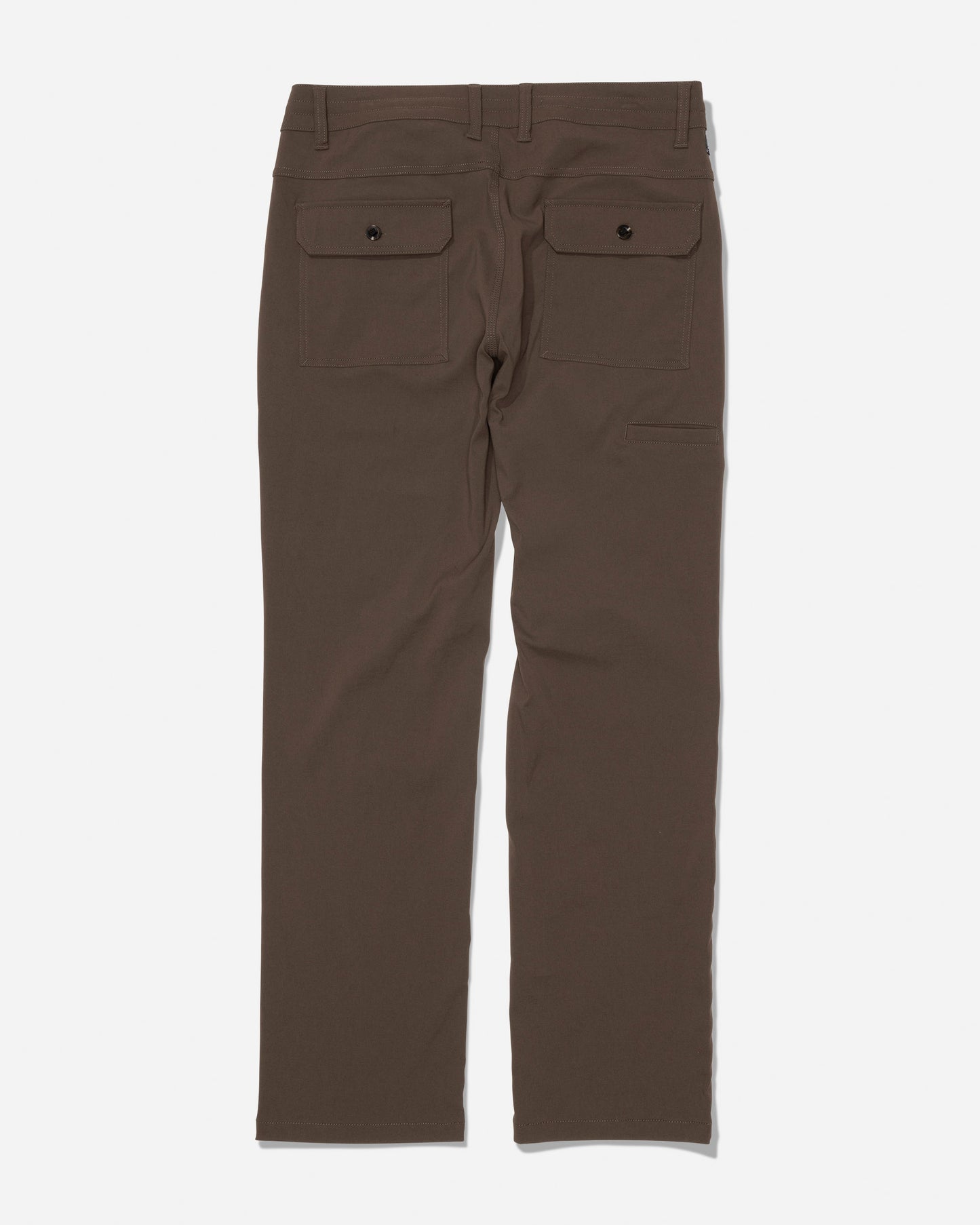 The Salty Crew Transom Tech Pant in Washed Brown is displayed from the back, showcasing two back pockets with buttoned flaps and belt loops at the waistband. Made from stain resistant, quick dry fabric, these pants are laid flat on a white background.