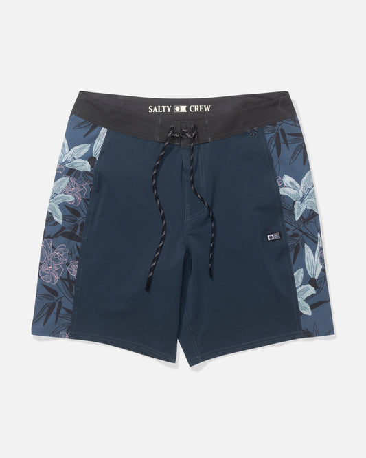 The Salty Crew Flagship 20" Boardshort in Deep Ocean features a black waistband with drawstring, blue and white floral side panels, 4-way stretch fabric for performance, and Salty Crew branding on the waistband.