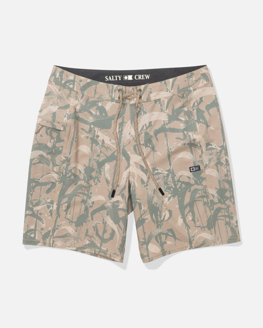 The Salty Crew Flagship 20" Boardshort in Kelp Camo features a tropical leaf print, front drawstring, side pockets, branded waistband, and is made from quick dry, 4-way stretch performance fabric. Shown flat on a white background.