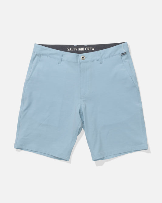 The Salty Crew Drifter 19" Hybrid Short in Mineral Blue features front pockets, a button closure, quick-dry recycled fabric, and a branded black-and-white inner waistband. Displayed on a white surface.