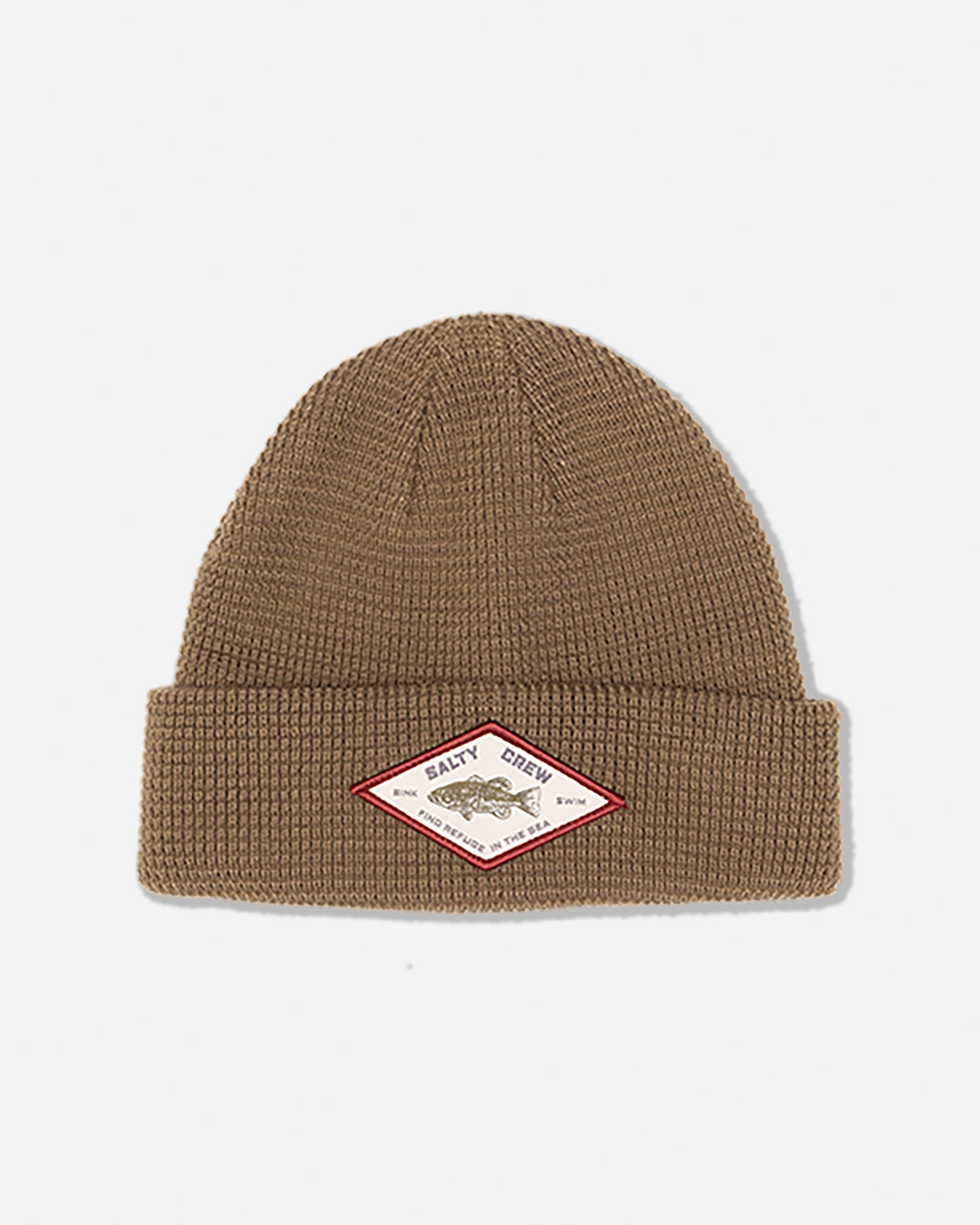 The Coastal Beanie - Twig by Salty Crew is a brown acrylic waffle knit beanie featuring a folded brim and six-dart construction, finished with a diamond-shaped woven patch displaying a fish and the Salty Crew name sewn on the front.