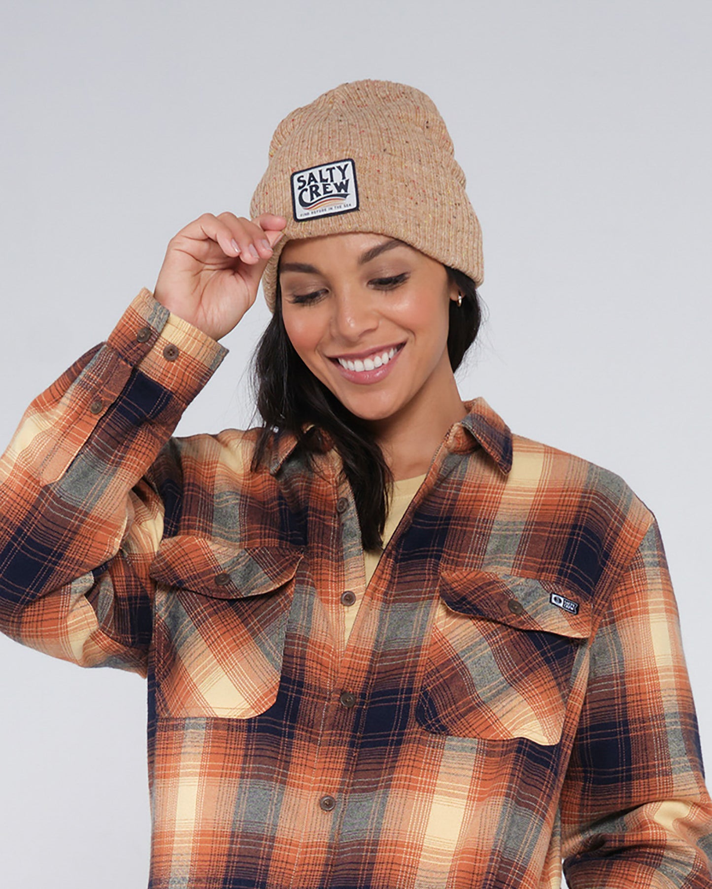 on body front view of The Wave Oatmeal Heather Beanie