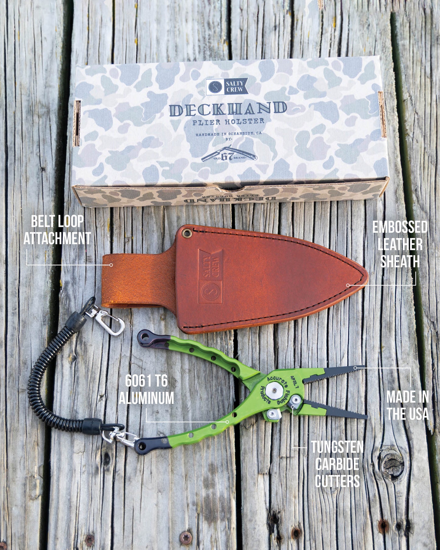 The Salty Crew Accurate x Salty Crew 7" Deckhand Plier in green aluminum, with a coiled lanyard, sits beside a brown embossed leather sheath and a camo Deckhand Pliers Holster box—essential labeled fishing gear.