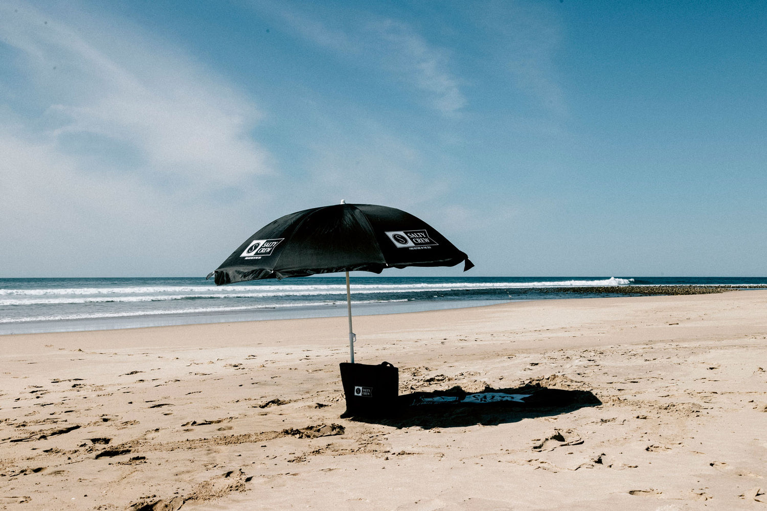 Shot of salty crew accessories on the beach