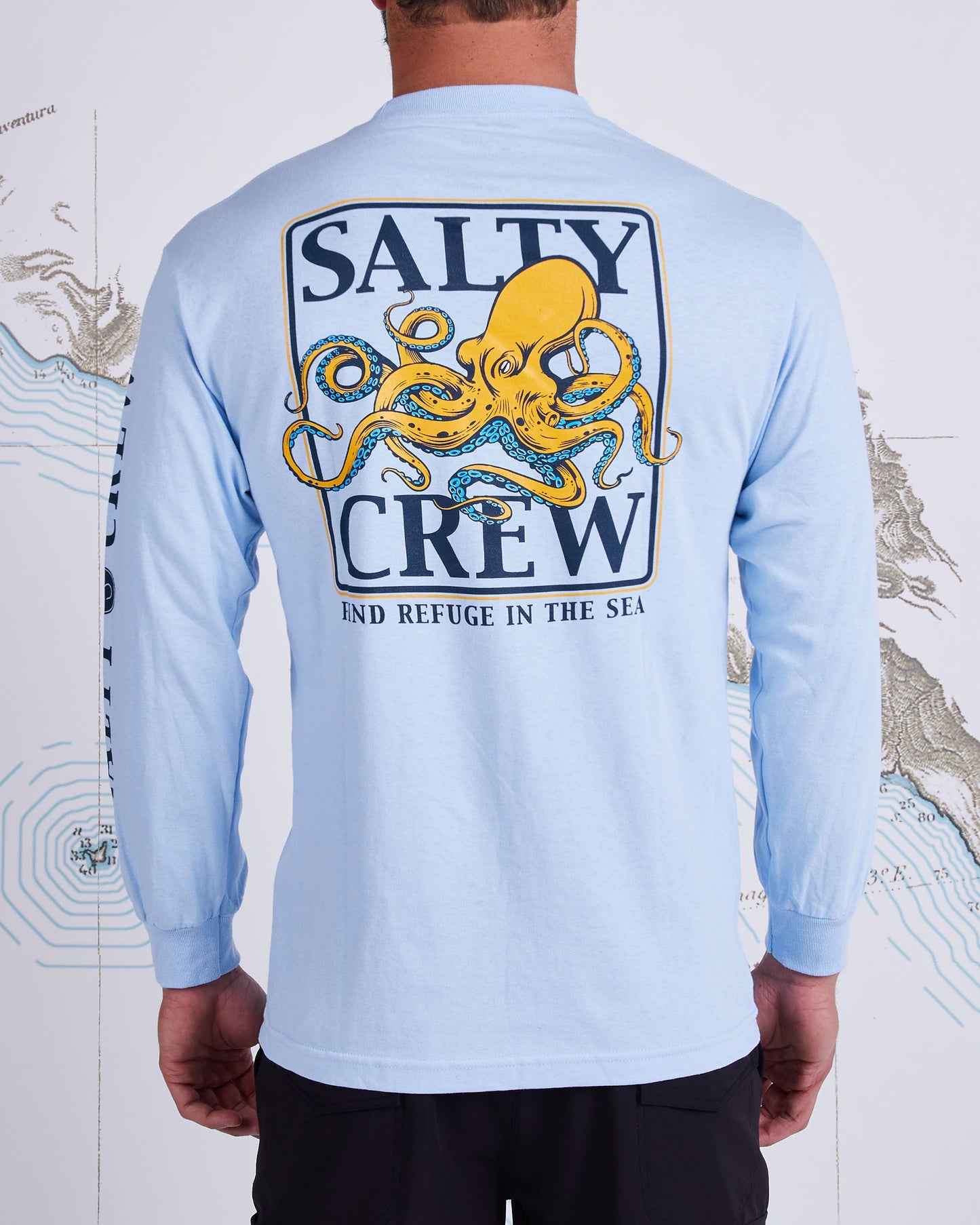 On body back of Ink Slinger Light Blue L/S Standard Tee