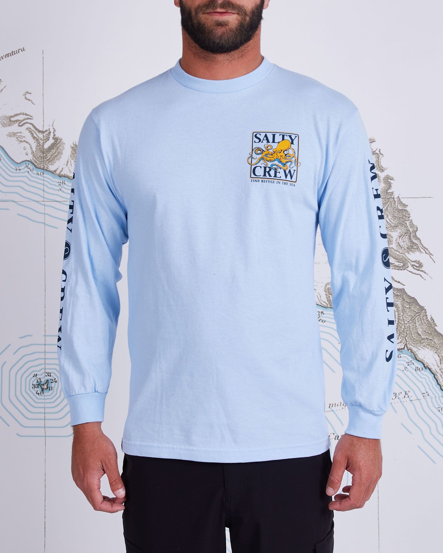 On body front of Ink Slinger Light Blue L/S Standard Tee