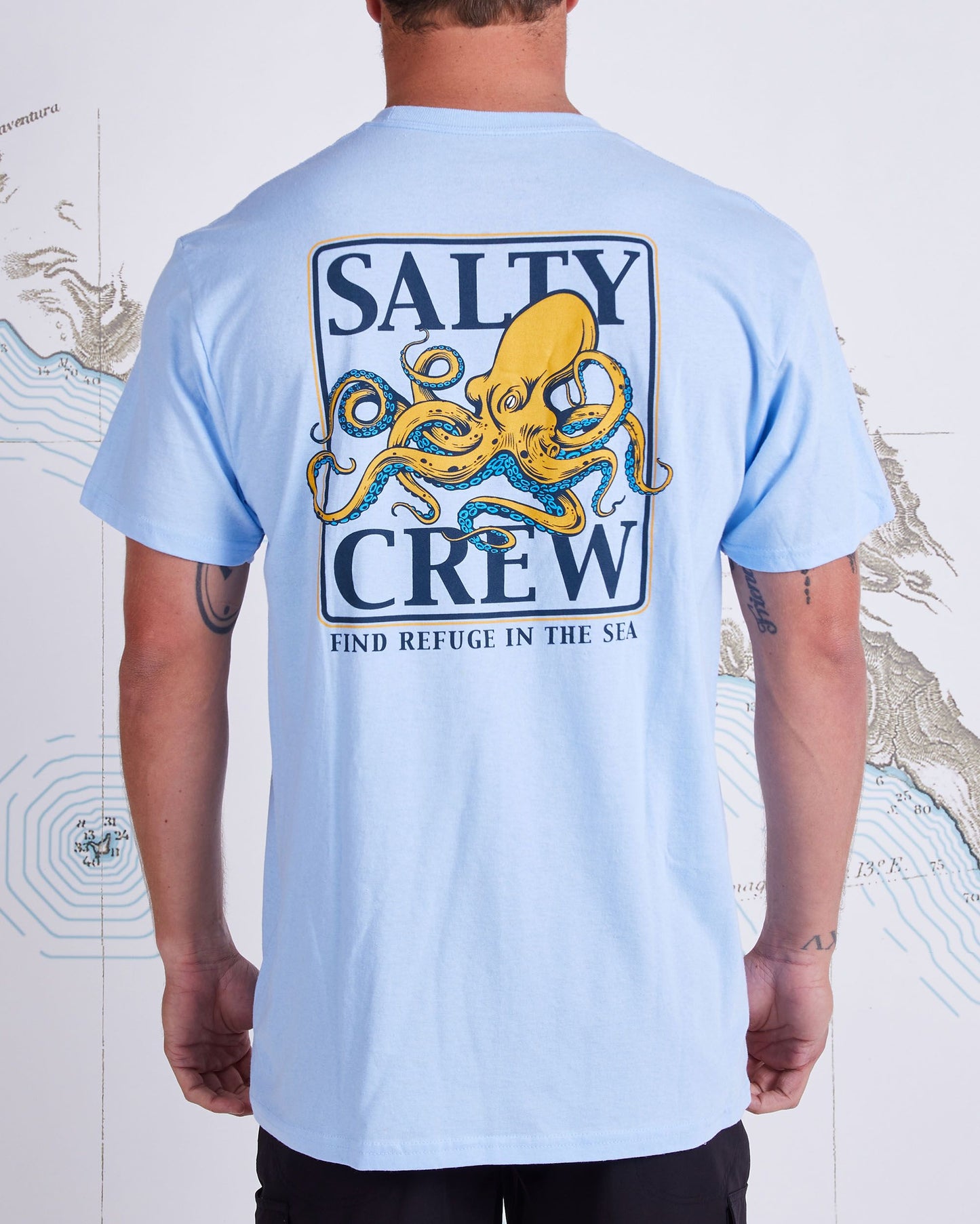 back graphic of Ink Slinger Light Blue S/S Standard Tee
