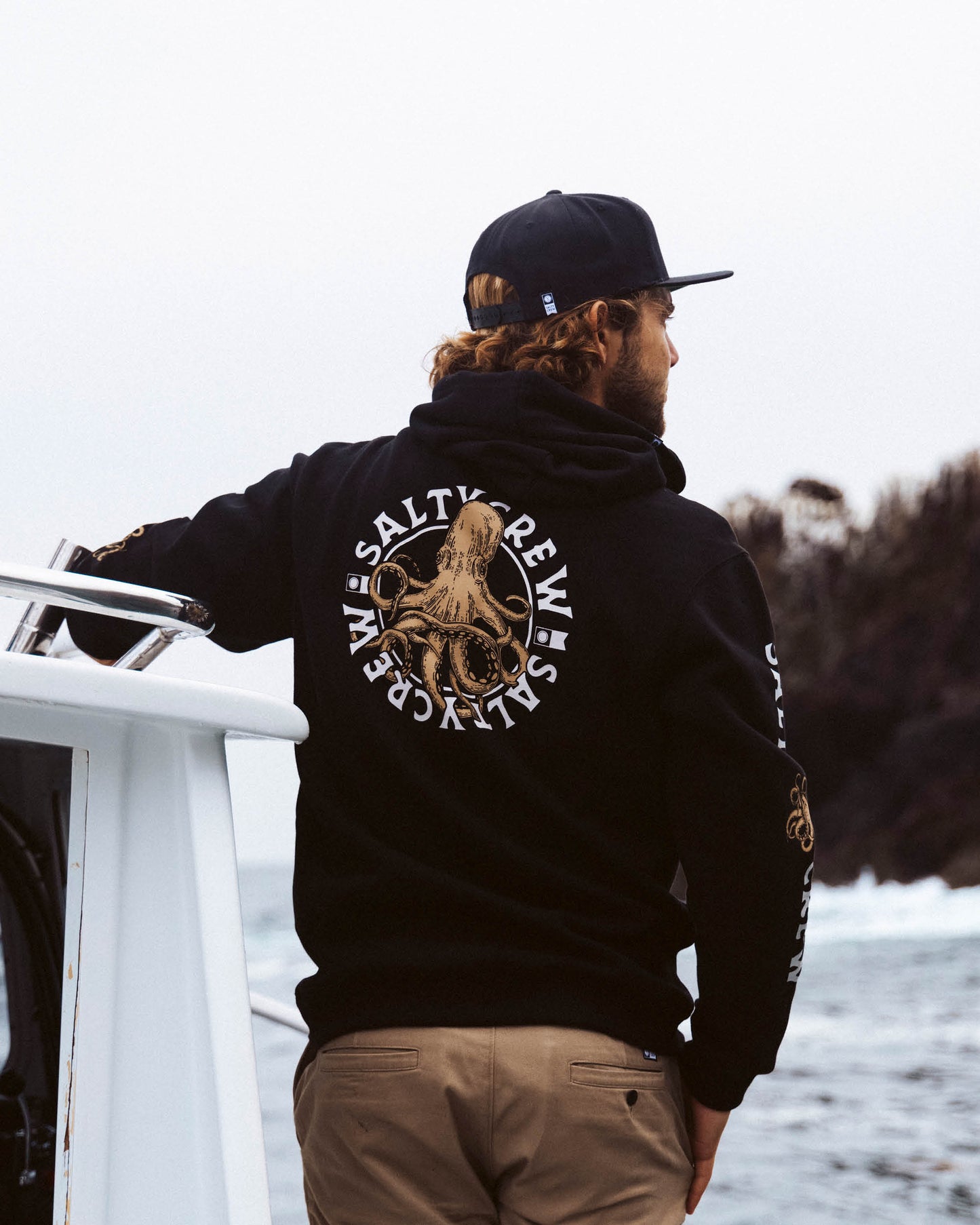 Lifestyle shot of the Tentacles Fleece Hoodie - Black. 