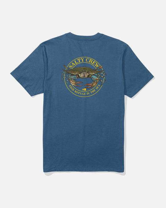 The Jimmy Crew Tee in Cast Blue by Salty Crew is a cotton t-shirt featuring a back graphic of a crab over water, bordered by the words “Salty Crew” and “Find Refuge in the Sea” in yellow screenprinted text.