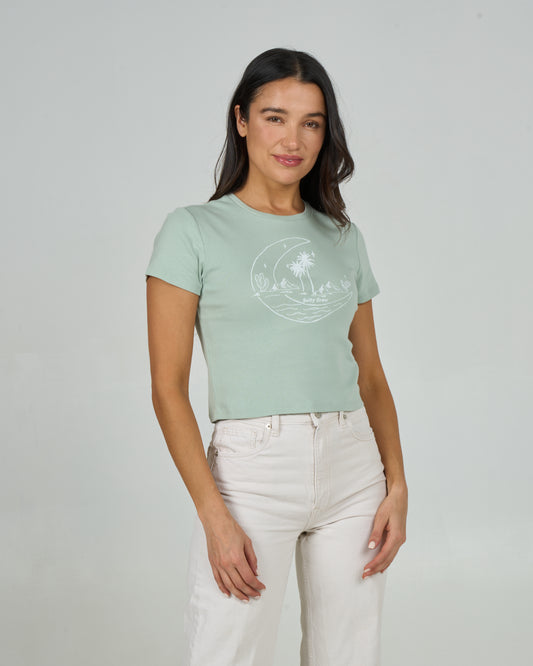 Front view of the Baja Baby Tee - Meadow Green. 
