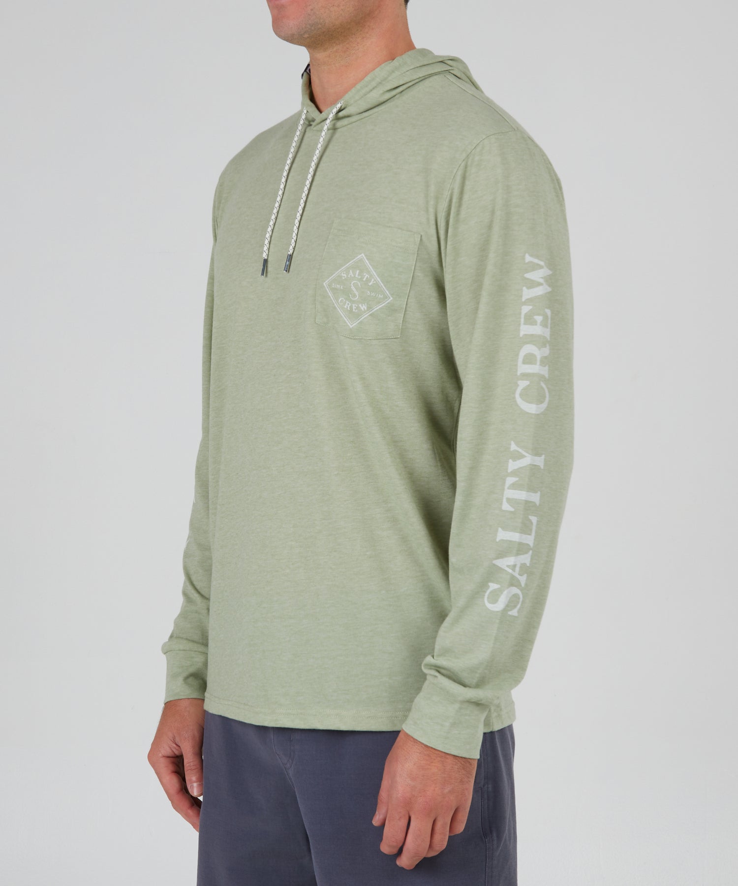front angled view of Tippet Dusty Sage Pocket Hood Tech Tee