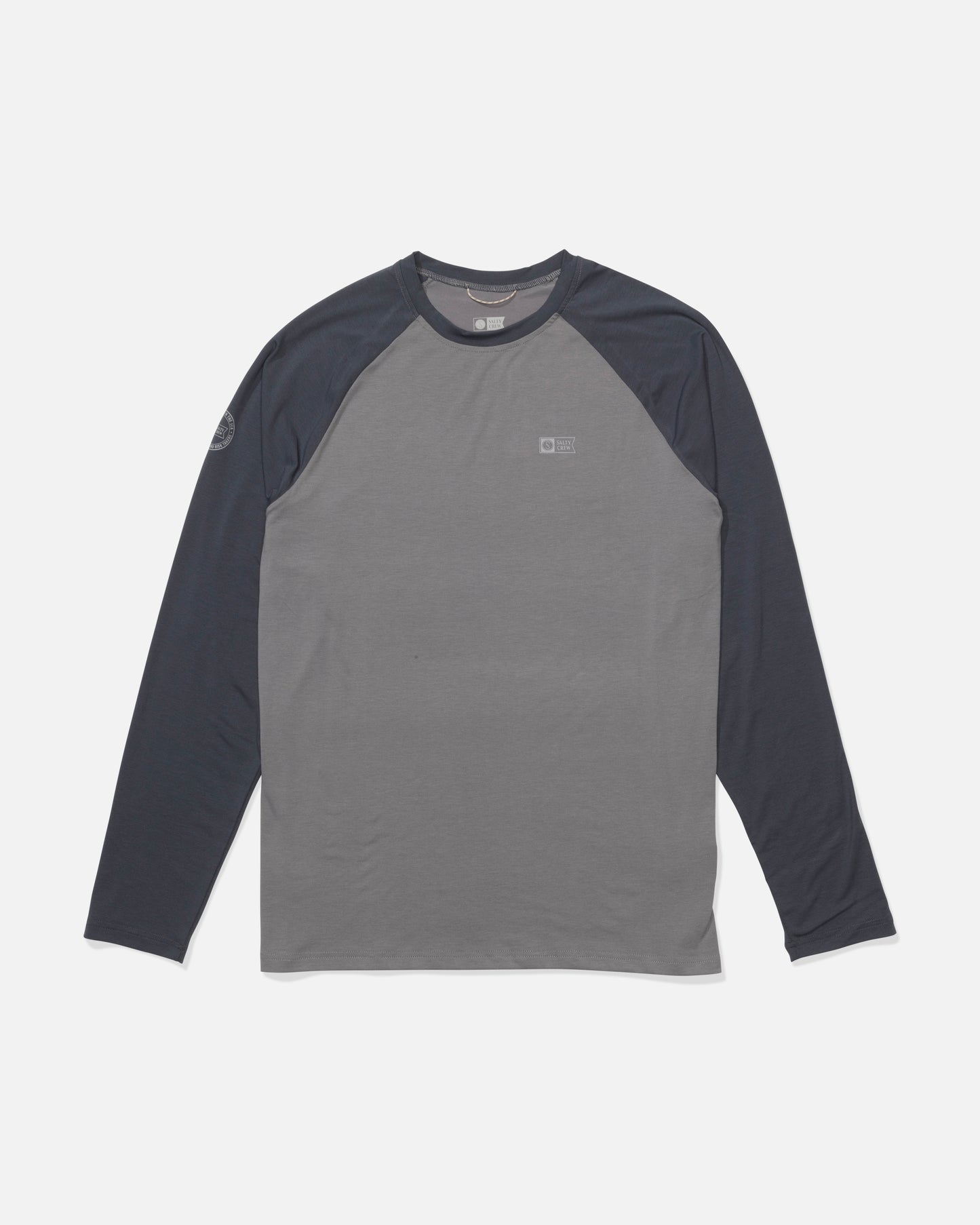 The Salty Crew Mariner Lite UV Sunshirt - Magnet features a long-sleeve, crew neck design with dark gray sleeves, a lighter gray body, moisture-wicking fabric, and small logos on the left chest and right sleeve. Displayed flat on a white background.