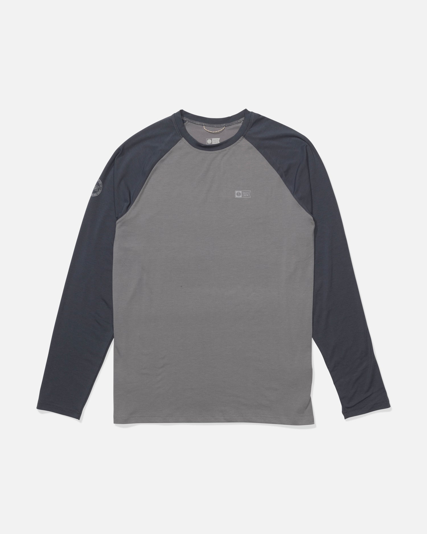 The Salty Crew Mariner Lite UV Sunshirt - Magnet features a long-sleeve, crew neck design with dark gray sleeves, a lighter gray body, moisture-wicking fabric, and small logos on the left chest and right sleeve. Displayed flat on a white background.