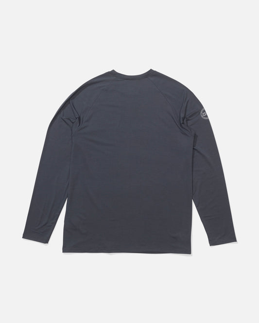 A Salty Crew Mariner Lite UV Sunshirt in Cast Blue is laid flat, back up. Made from technical knit, it offers UPF 50+ sun protection and has a small logo on the right sleeve near the shoulder.