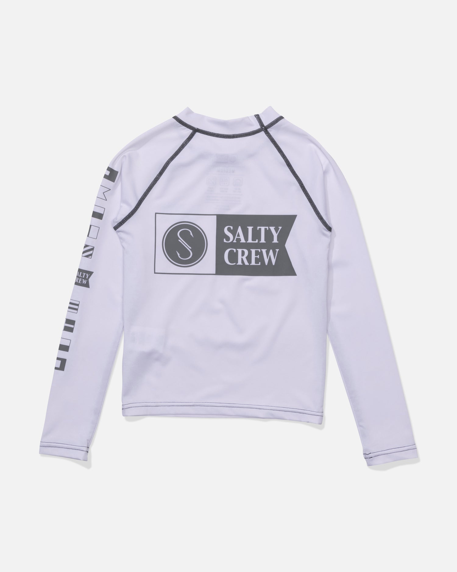The Salty Crew Alpha Boys Rashguard in white features long sleeves, black seams, a large Salty Crew logo on the back, and small black icons along the right sleeve.