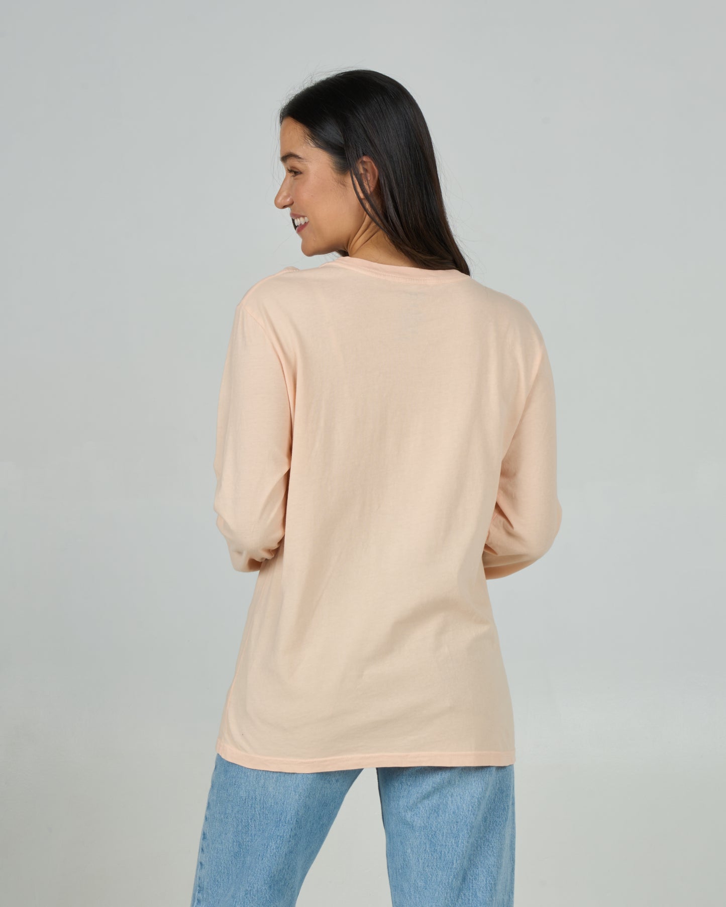 Back view of the Heart Shark Long Sleeve Boyfriend Tee - Peach Fizz. 