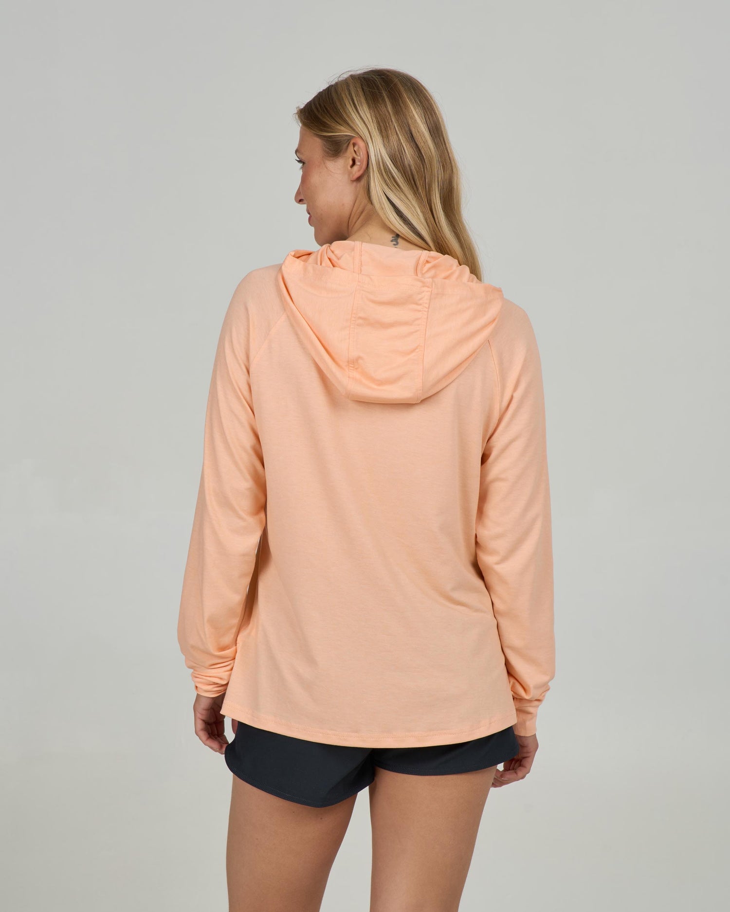 Back view of the Circled Tech Hoody - Apricot.