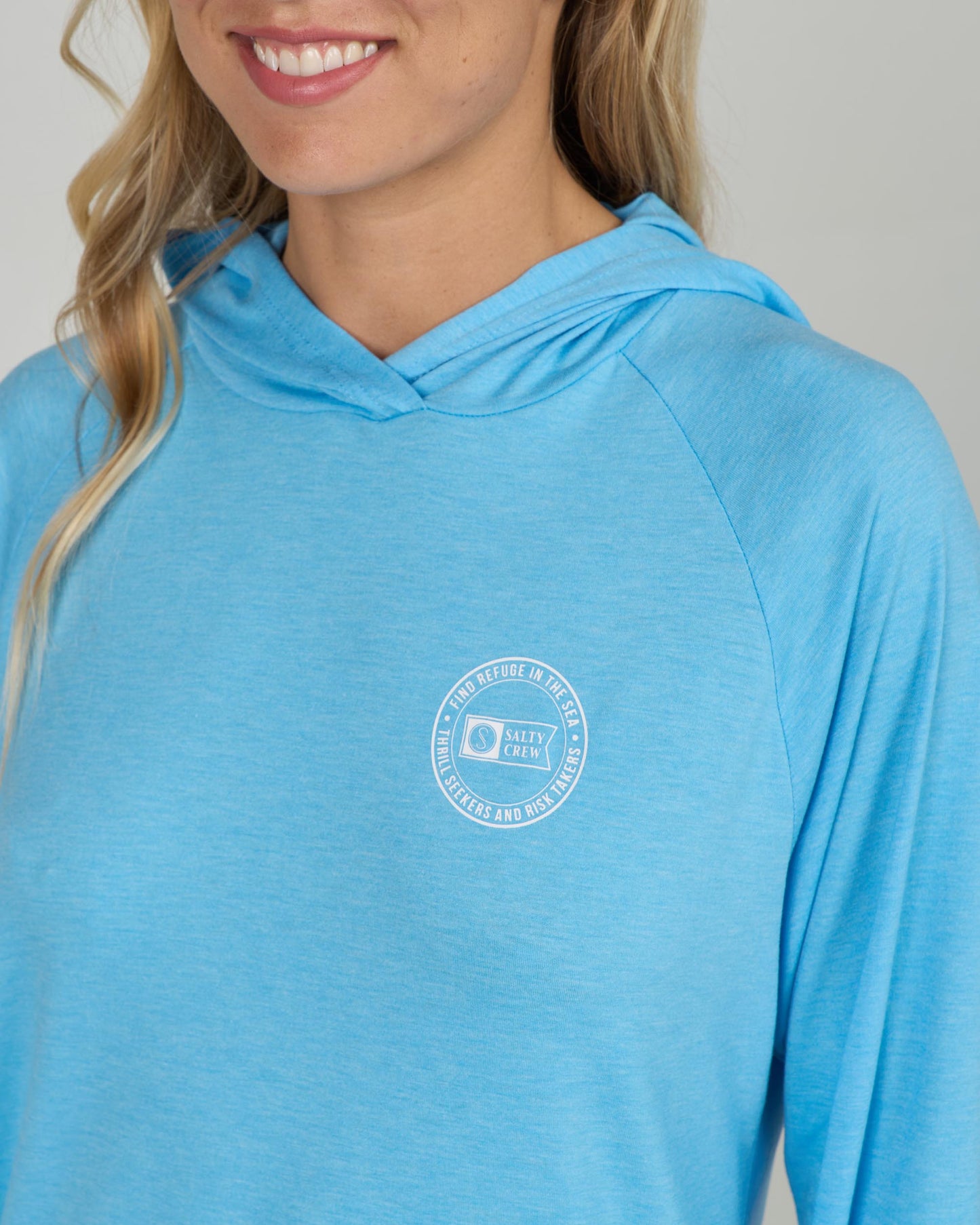 Close up view of the Circled Tech Hoody - Pool Blue. 