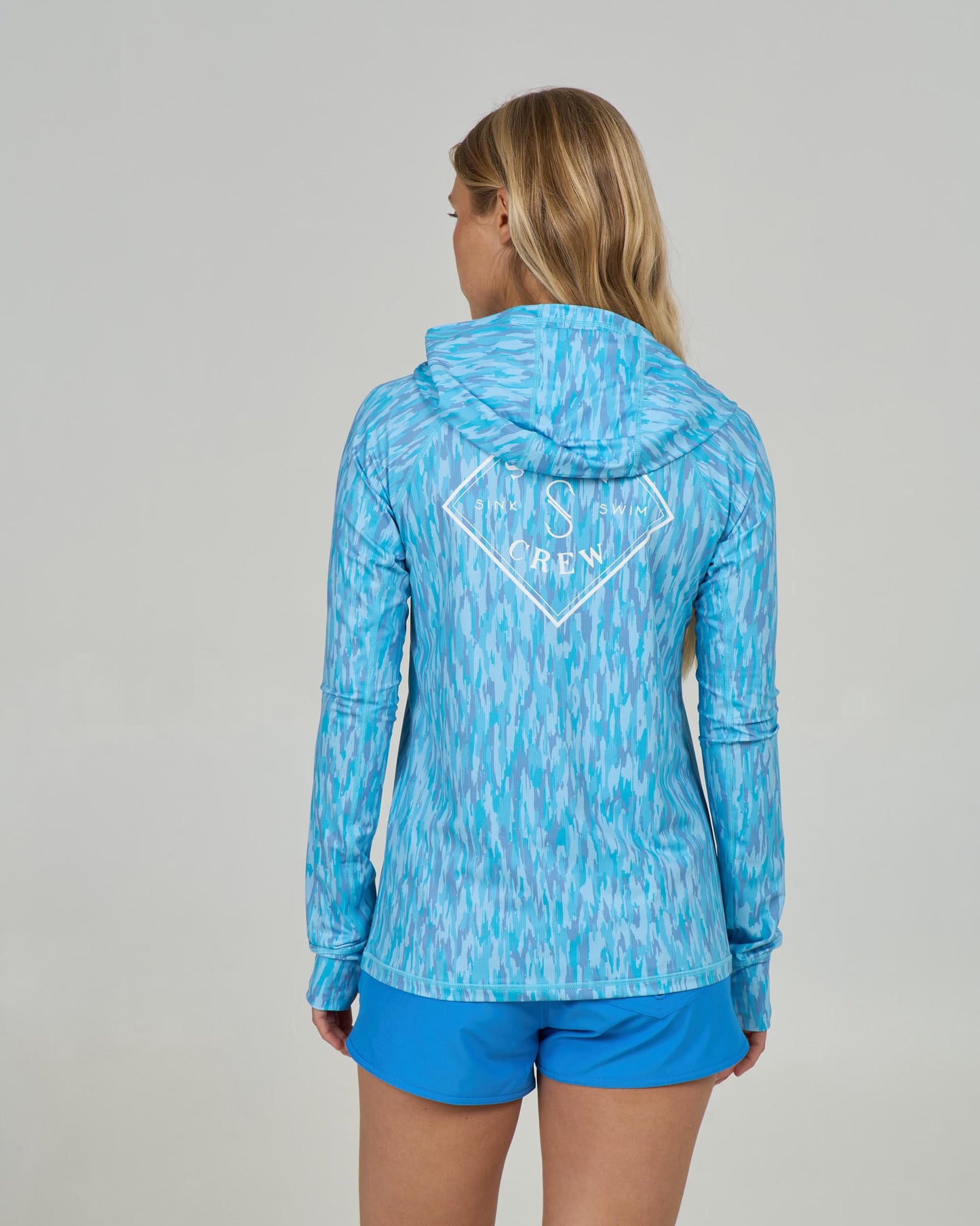 Back view of the Apex Sunshirt - Pool Blue. 