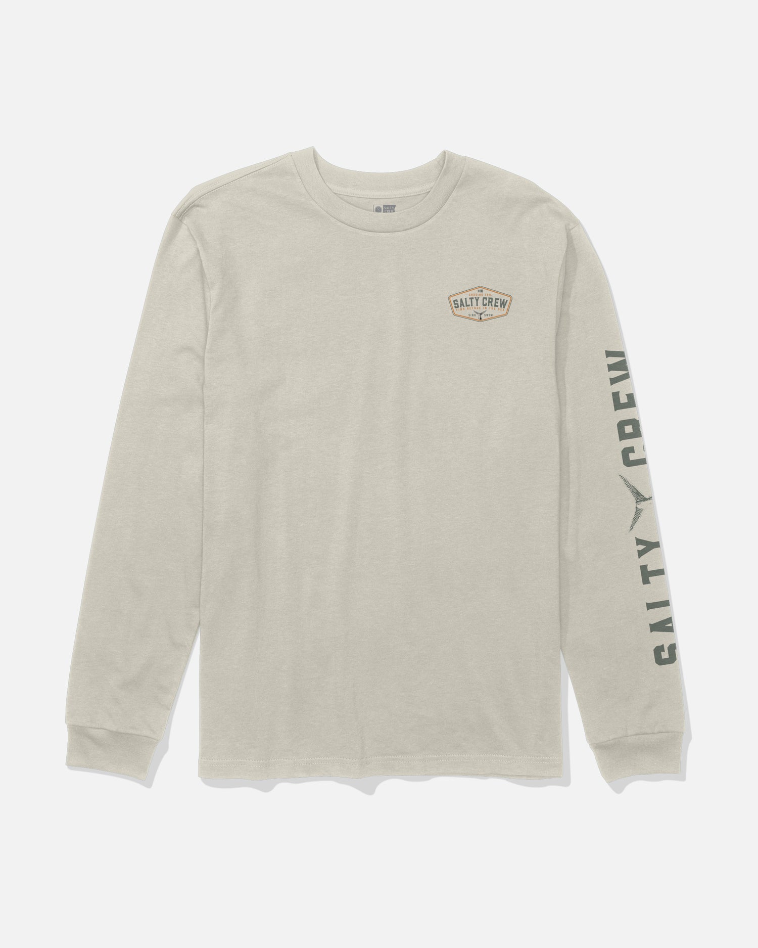 The Salty Crew Tailfin Long Sleeve Tee in Bone is a beige, combed ringspun cotton t-shirt with “Salty Crew” text on the left chest and down the right sleeve, featuring a screenprinted small graphic patch on the chest.