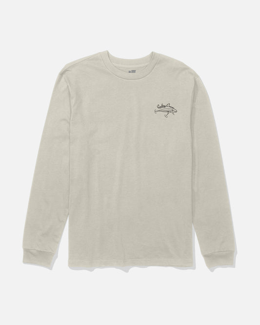 The Salty Crew Decoy Long Sleeve Tee in Bone is a light beige cotton t-shirt with long sleeves, crafted from soft combed ringspun fabric and featuring a small black screenprinted logo and text on the left chest, displayed laid flat on a white background.