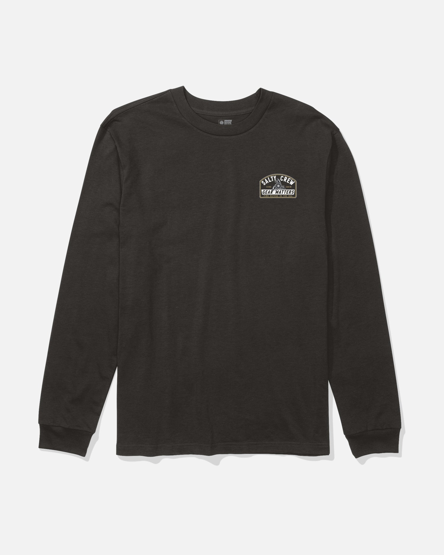 Salty Crew Gear Shop Long Sleeve Tee in black, crafted from combed ringspun cotton and featuring a small white “Daily Grind Tool Supply” screenprinted graphic on the left chest. The shirt is shown laid flat on a white background.