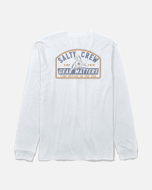 The Salty Crew Gear Shop Long Sleeve Tee in white is made from soft, combed ringspun cotton and features a large screenprinted back graphic with the text “Salty Crew Gear Matters. Sink Swim. Find Refuge in the Sea” alongside a ship’s wheel illustration for lasting quality.
