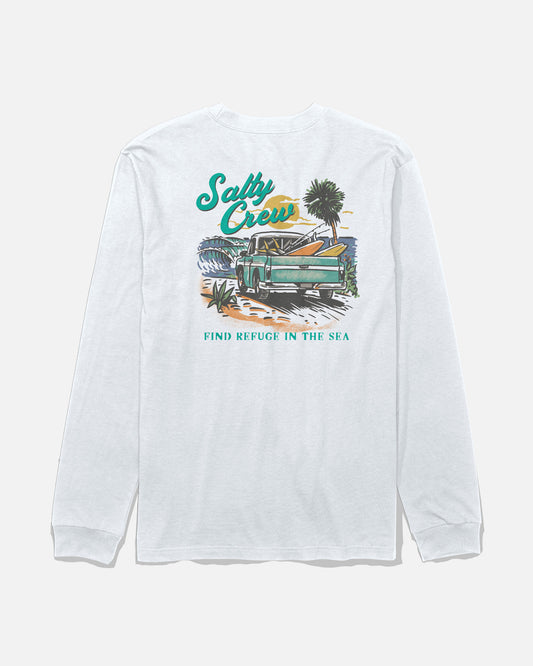 The Salty Crew Truck Bed Long Sleeve Tee in white is a cotton t-shirt featuring a screenprinted graphic on the back with a green truck, surfboards, palm trees, ocean waves, and the text “Salty Crew” and “Find Refuge in the Sea.”.
