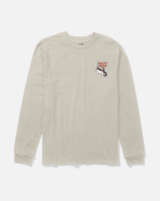 The Salty Crew Beach Cruiser Boys Long Sleeve Tee in Bone is a beige long-sleeve shirt made from combed ringspun cotton, featuring a small screenprinted Salty Crew logo and fish graphic on the left chest. The tee is displayed laid flat against a white background.