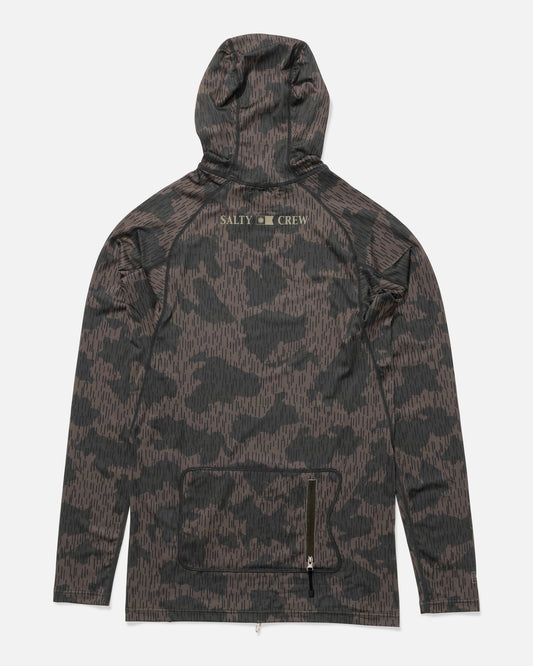 The Salty Crew Apex Hooded Rashguard - Recon Camo is a lightweight, long-sleeve surf hoodie with a dark camo pattern, front zip pocket, light green SALTY CREW print on the upper back, UPF 50+ sun protection, shown on a plain white background.