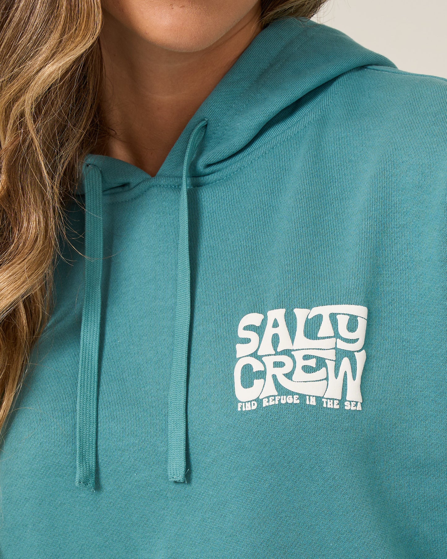 Close up front view of the Freestyle Hoodie - Teal. 