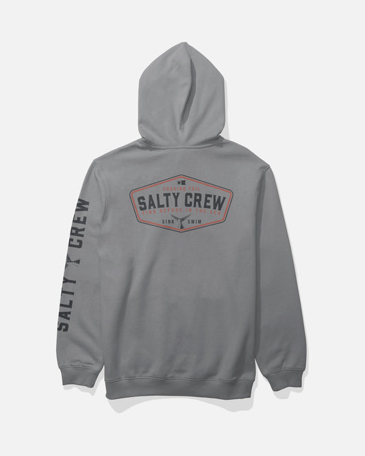 The Salty Crew Tailfin Fleece - Shark Skin is a gray cotton polyester hoodie with bold Salty Crew branding screenprinted in large letters on the back and sleeve, along with “Sink or Swim” text inside a distinctive badge-shaped design. This comfortable hoodie also features a classic kangaroo pocket for added functionality.