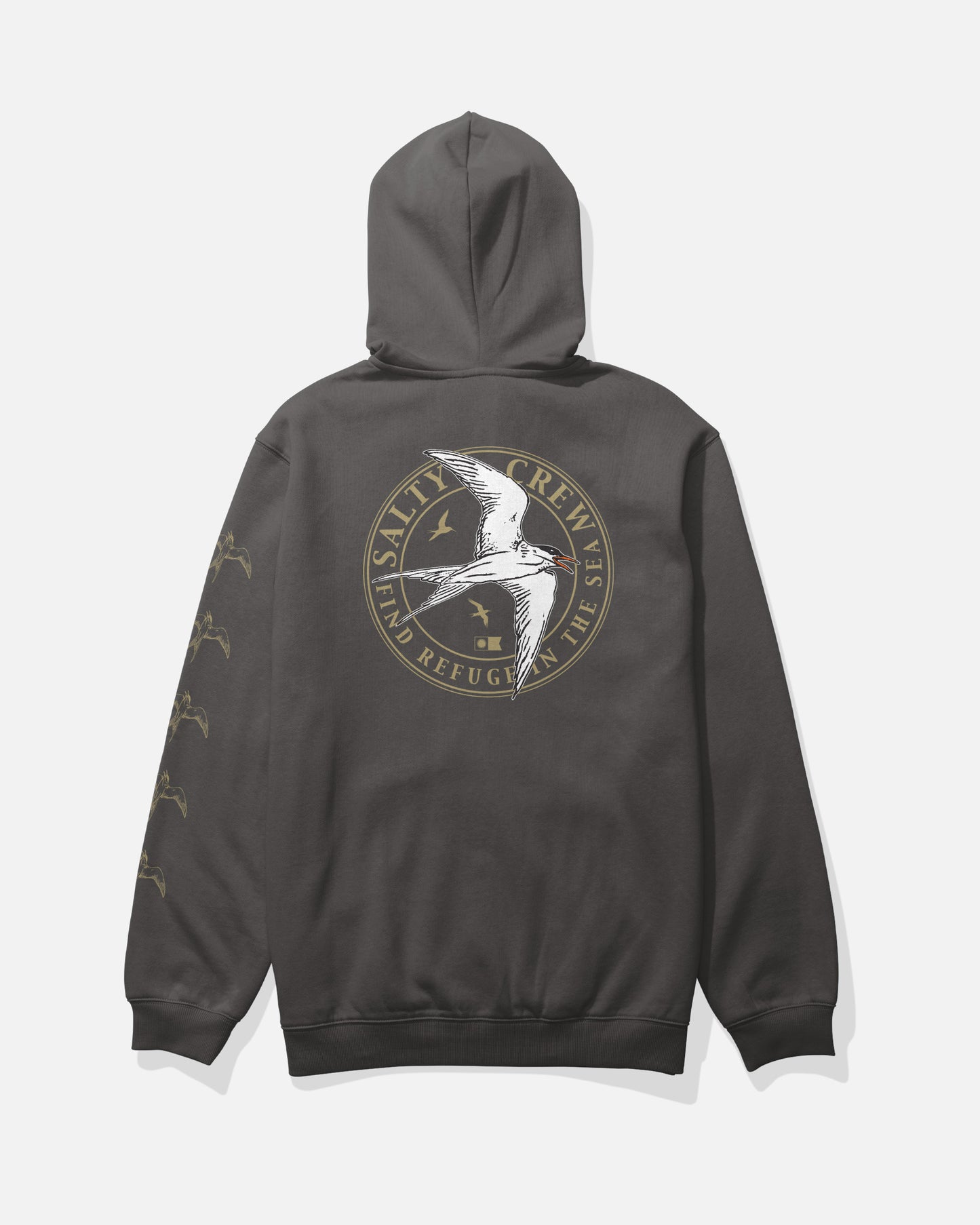 The Salty Crew Tern Fleece in dark grey is a mid-weight hoodie made from a soft cotton-polyester blend, featuring a large circular logo with a flying seabird and the words “Salty Crew: Find Refuge in the Sea” printed on the back, as well as small bird graphics screenprinted along the sleeve.