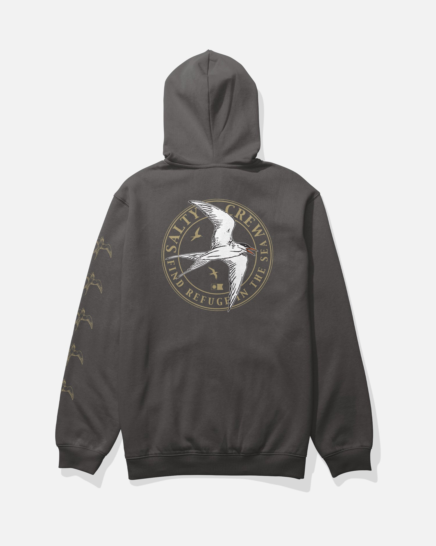 The Salty Crew Tern Fleece in dark grey is a mid-weight hoodie made from a soft cotton-polyester blend, featuring a large circular logo with a flying seabird and the words “Salty Crew: Find Refuge in the Sea” printed on the back, as well as small bird graphics screenprinted along the sleeve.