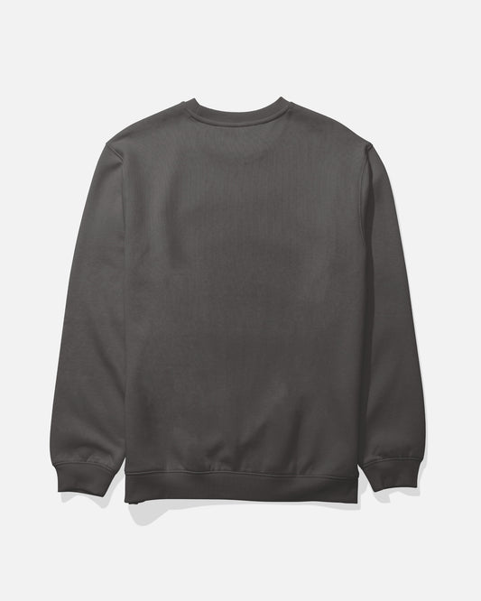 The Salty Crew Crafted Crew Fleece in Dark Grey is displayed from the back against a white background. This mid-weight sweatshirt features a cotton-polyester blend, long sleeves, ribbed cuffs and hem, and a classic V-stitch gusset at the crewneck for added style and durability.