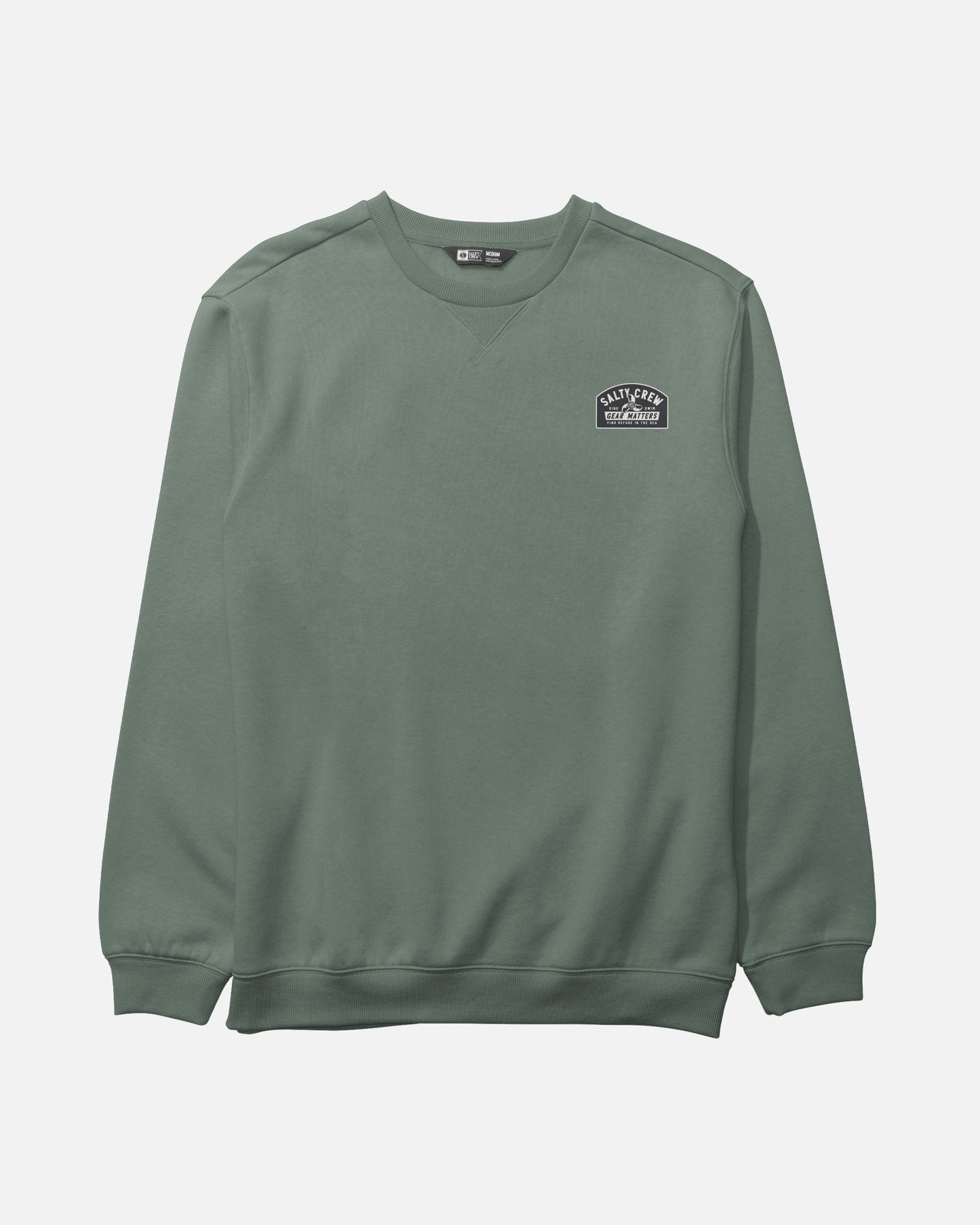 Introducing the Salty Crew Crafted Crew Fleece in Laurel Wreath—a green mid-weight sweatshirt made from a soft cotton-polyester blend. This crewneck features ribbed cuffs and hem, a classic V-stitch gusset at the collar, and a small black and white patch on the left chest that reads “Valley Peak Originals.” Displayed against a plain white background.