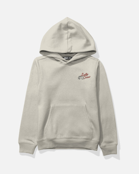 The Salty Crew Truck Bed Boys Fleece - Bone is a light beige mid-weight cotton-polyester hoodie featuring a front kangaroo pocket. A small, screenprinted graphic of a vintage pickup truck and “Salty Crew” in red script accents the left chest, all set against a plain white background for lasting style.