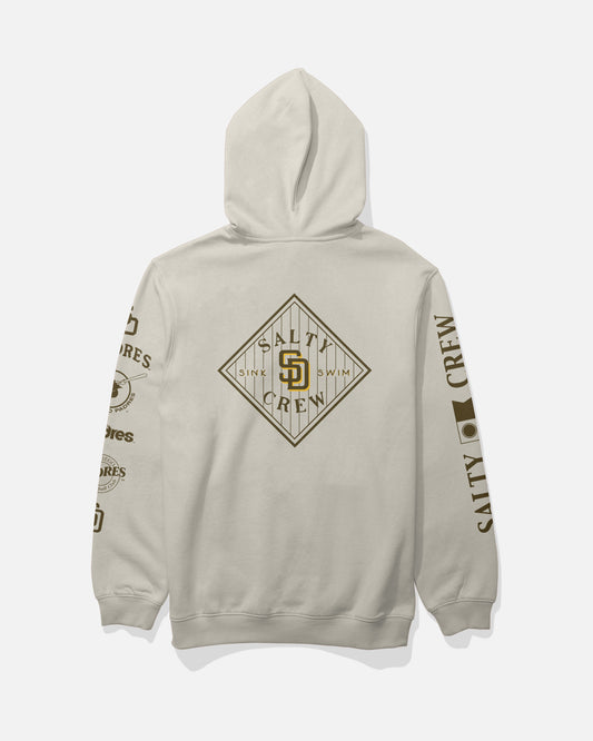 Introducing the Salty Crew Padres Tippet Fleece in Bone—a beige hooded sweatshirt highlighted by a bold Salty Crew diamond logo on the back and distinctive brown graphics and text down each sleeve. This limited edition piece is ideal for fans of unique streetwear style.