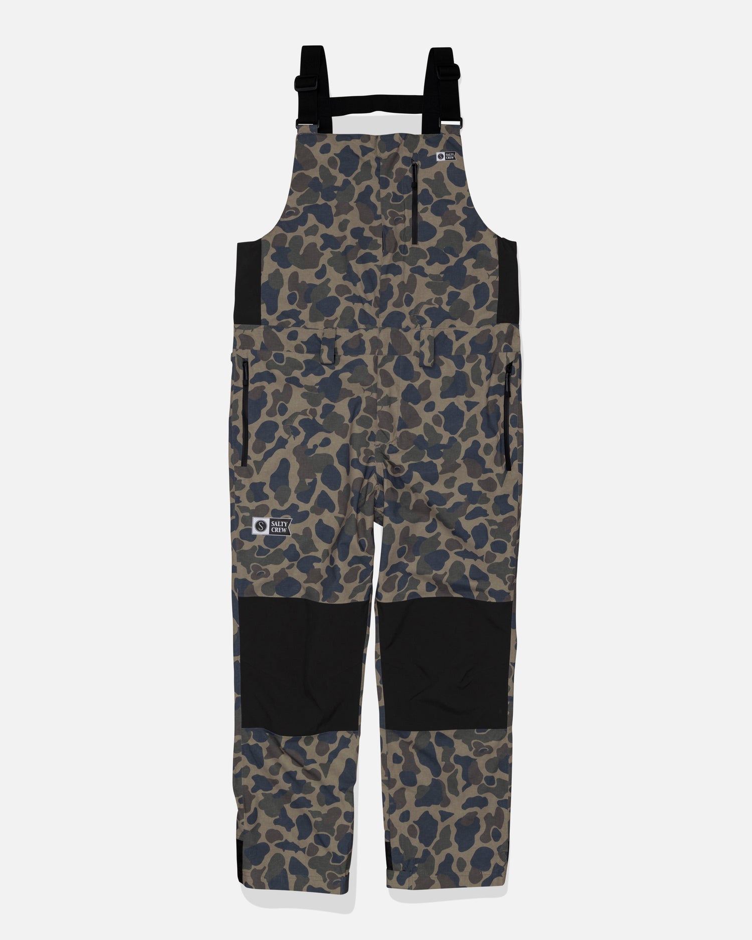 Salty Crew Long Range Tech Bib - Sand Camo features a camouflage pattern, black adjustable straps, black knee patches, side pockets, and logo patches on the chest and leg. Made from durable fabric and shown on a plain white background.