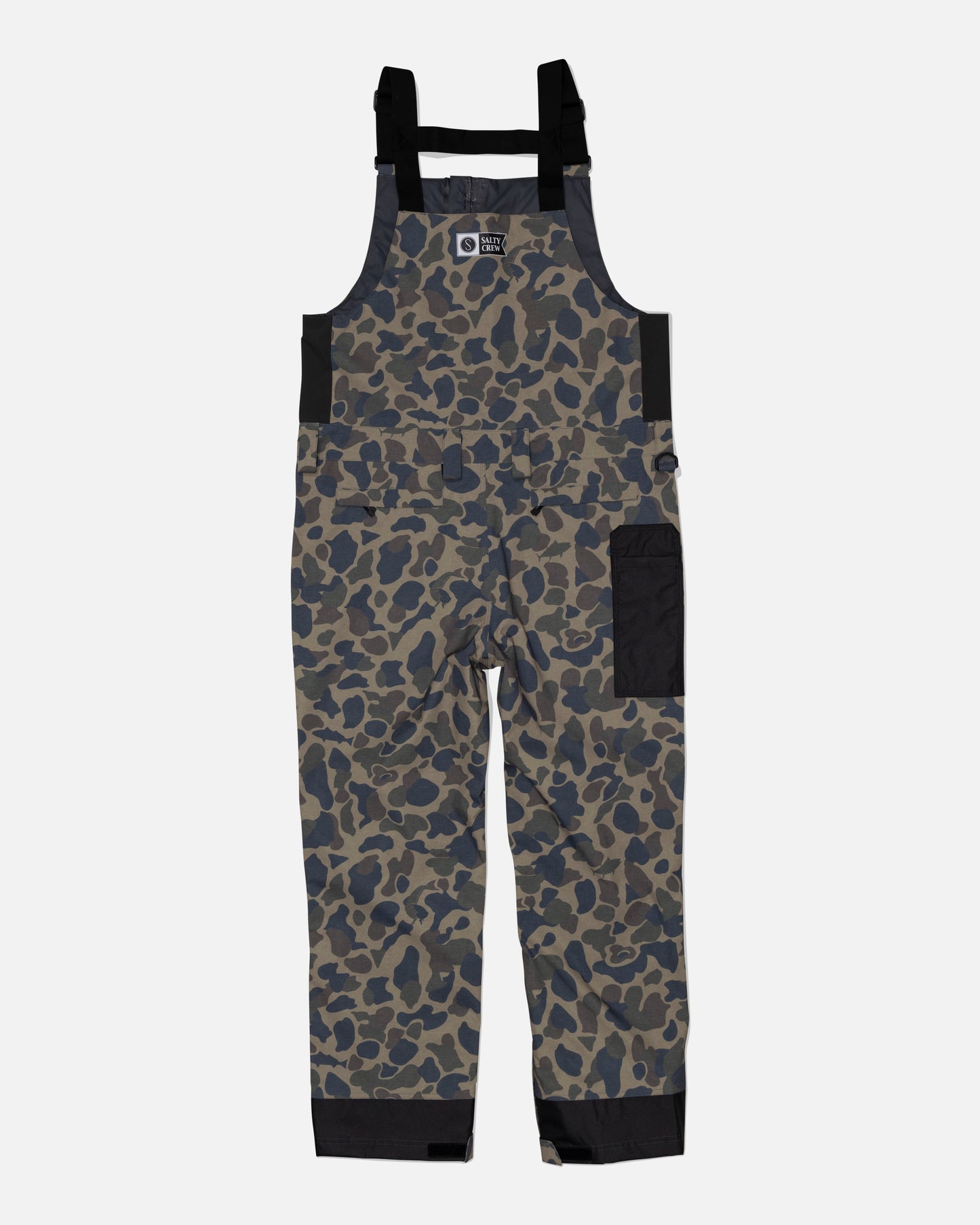 The Salty Crew Long Range Tech Bib - Sand Camo features black adjustable straps, a chest pocket flap, a large side pocket, reinforced black ankle panels, and a front zipper for durability and long-lasting performance.
