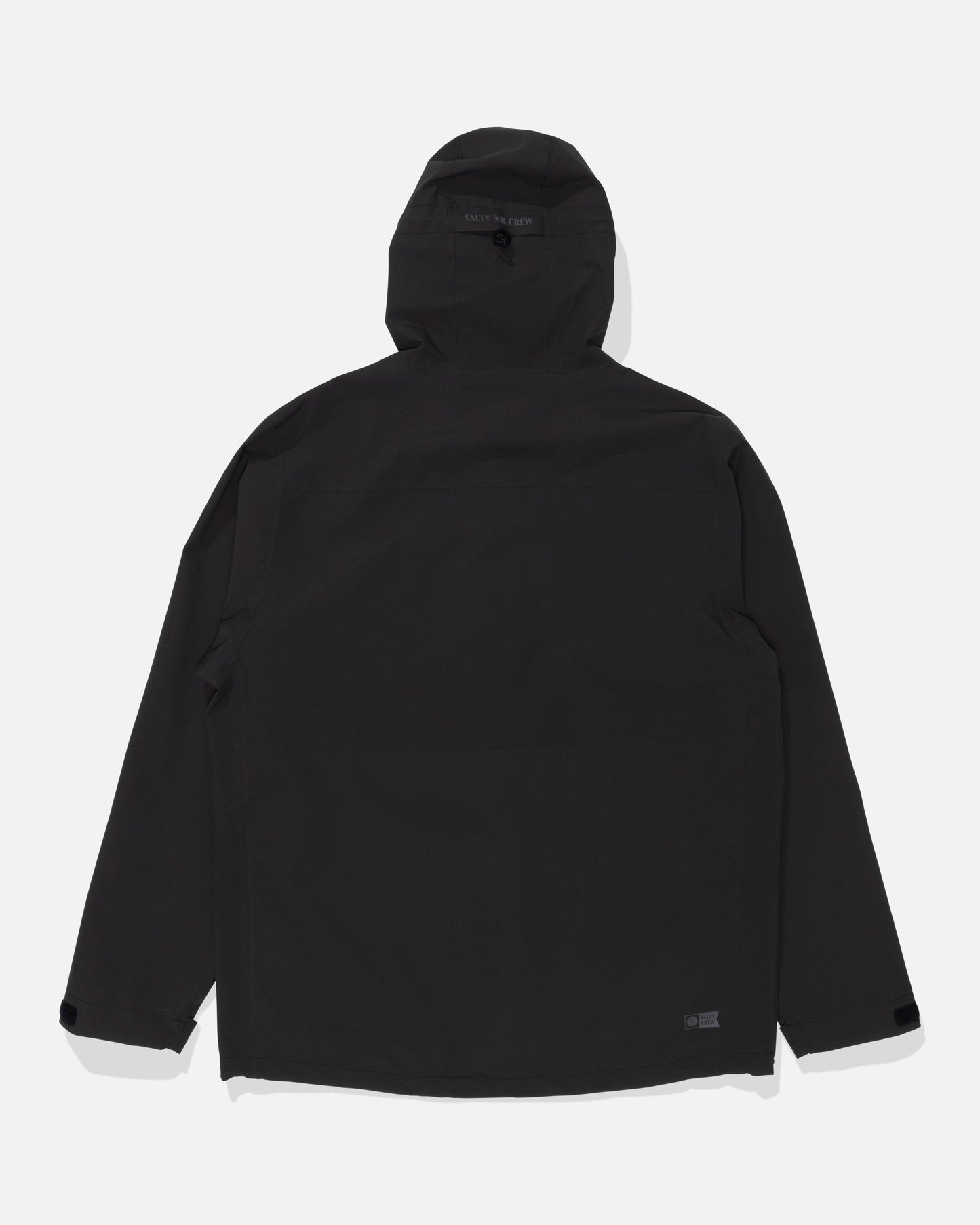 The Salty Crew Long Range Jacket in black is displayed flat, showing the back side with long sleeves and adjustable cuffs. This waterproof jacket features taped seams for added protection against the elements.