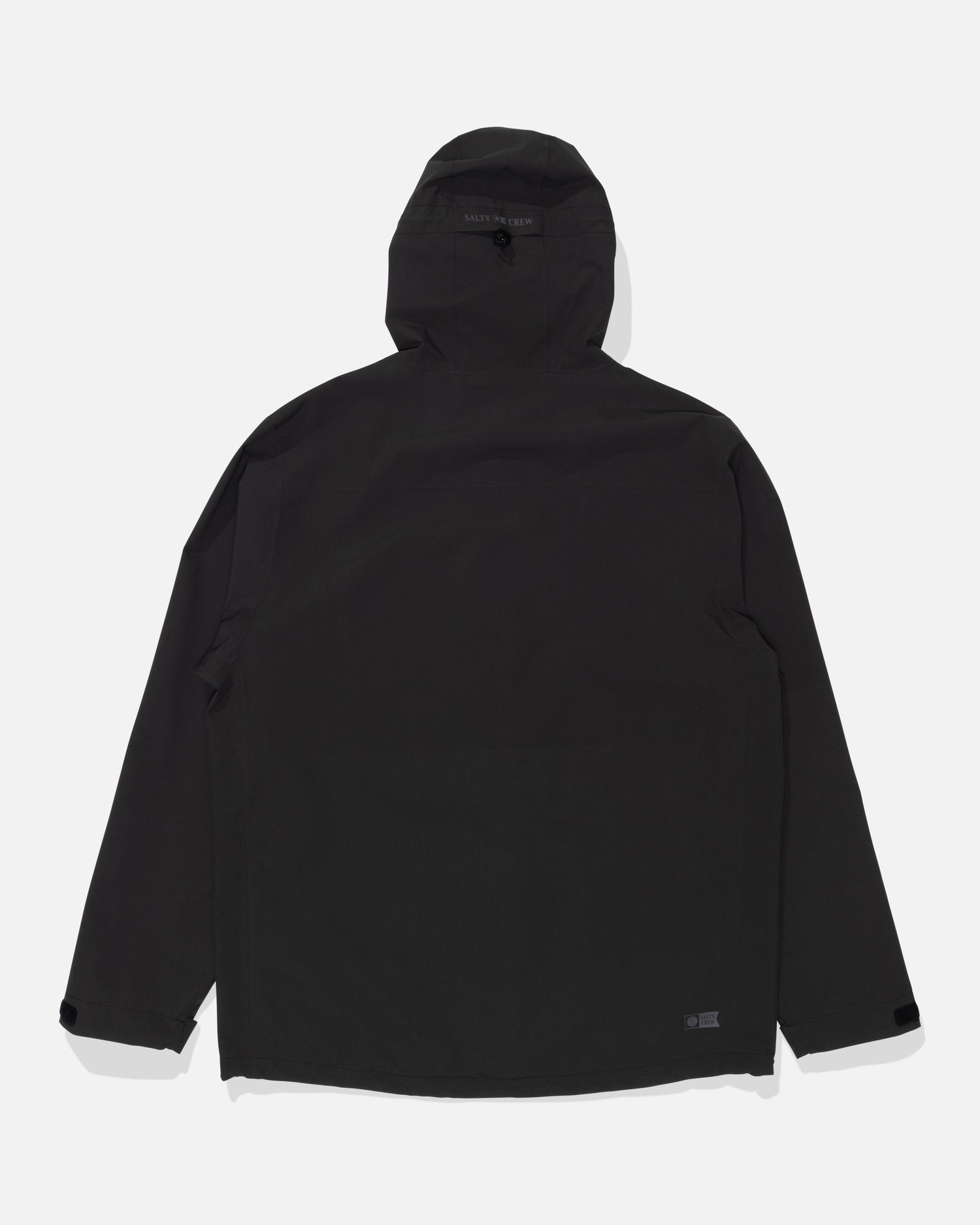 The Salty Crew Long Range Jacket in black is displayed flat, showing the back side with long sleeves and adjustable cuffs. This waterproof jacket features taped seams for added protection against the elements.