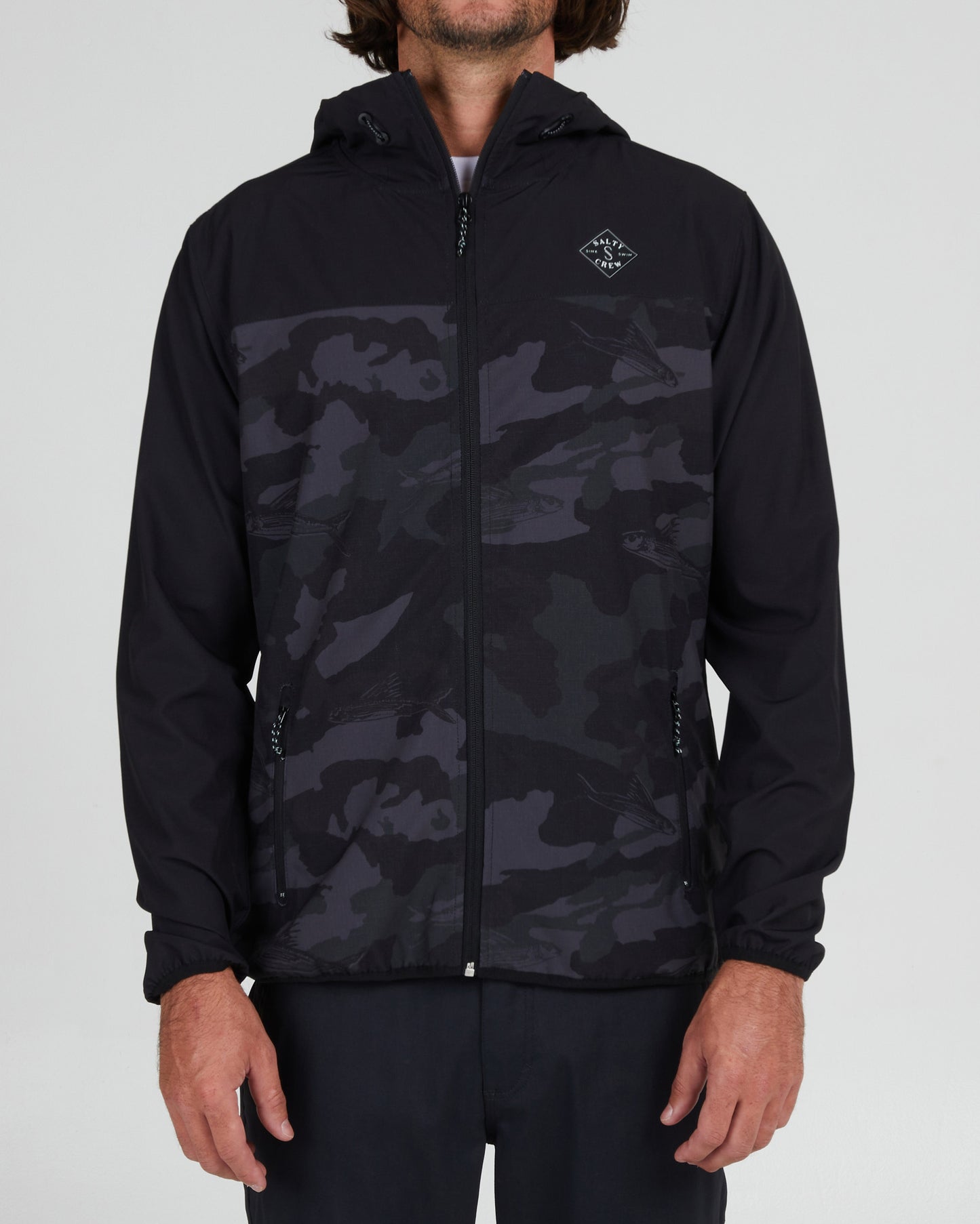 on body front of the Stowaway Black Camo Jacket