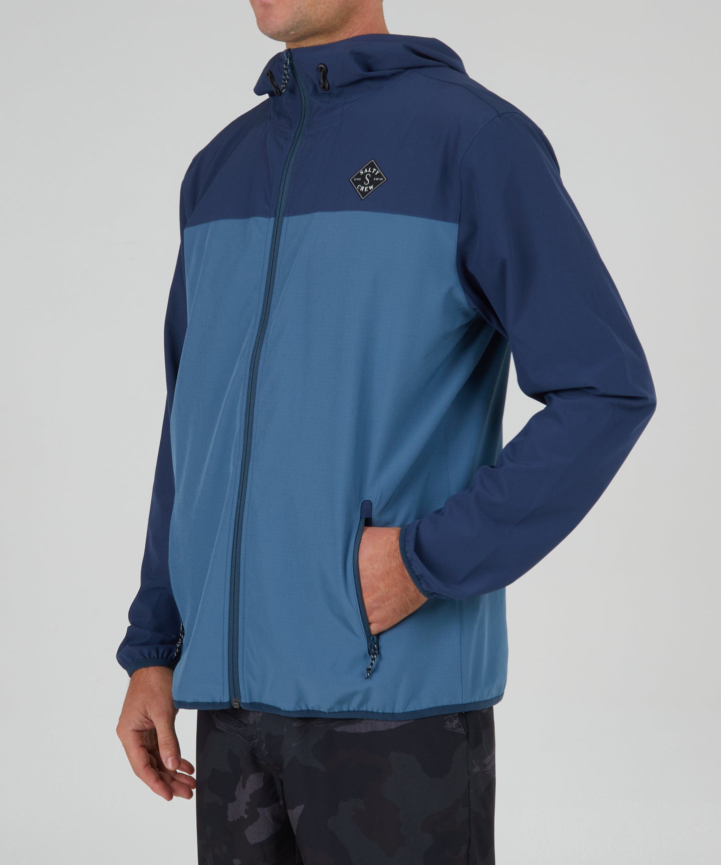 front angled view of Stowaway Navy Jacket