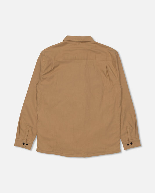 The Salty Crew Fathom Tech Shacket in Khaki is shown from the back, featuring a collar, buttoned cuffs, and a plain design crafted from mid-weight twill for versatile comfort.