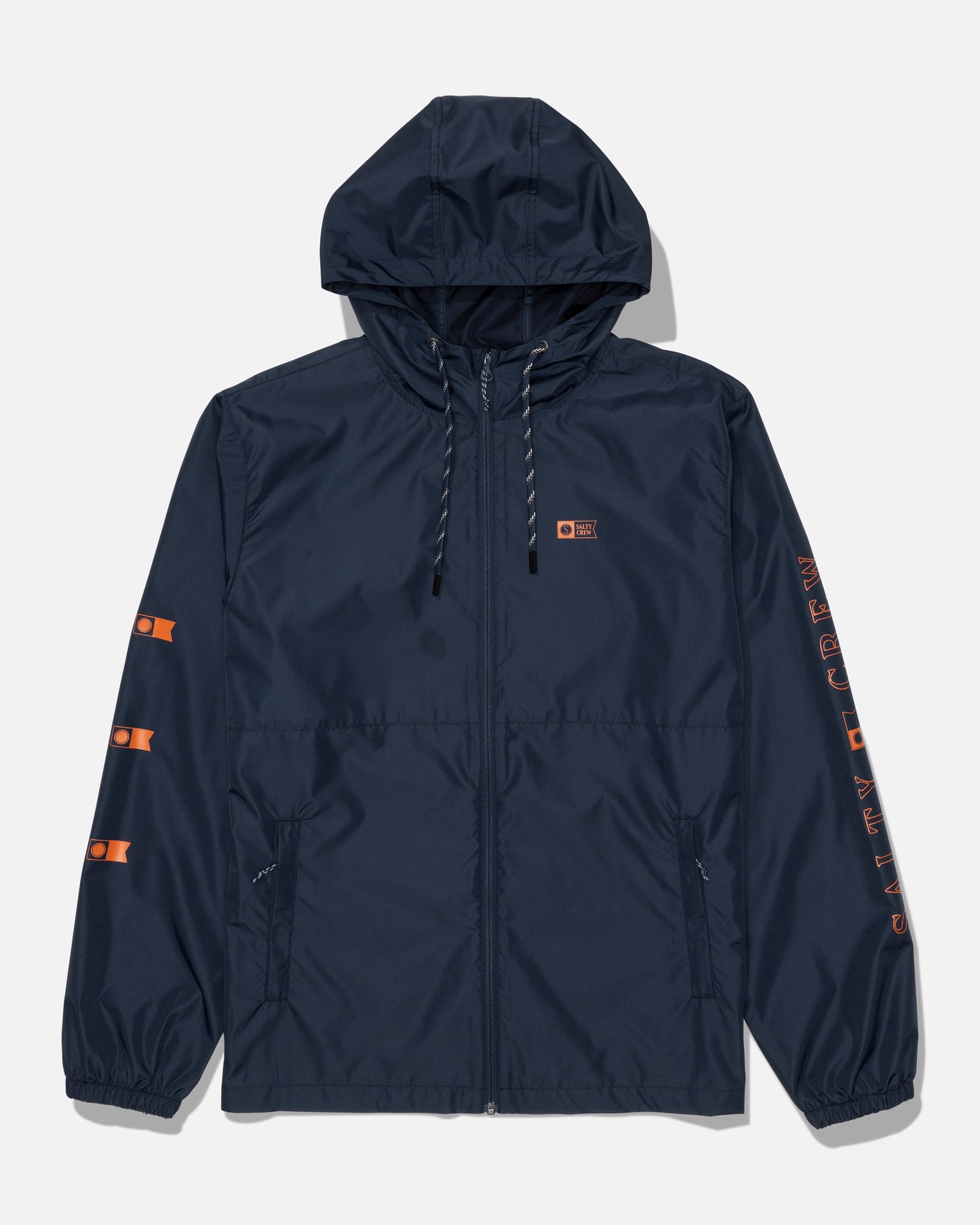 Introducing the Salty Crew Surface Windbreaker Jacket - Navy/Orange: This navy blue hooded jacket features a front zipper, an orange Salty Crew logo on the chest, and bold orange graphics along the left sleeve. Black-and-white drawstrings add a stylish touch, while the durable polyester shell with hydrophobic fabrication provides protection against the elements. Designed for convenience and comfort, it includes two zippered hand pockets and elastic cuffs.
