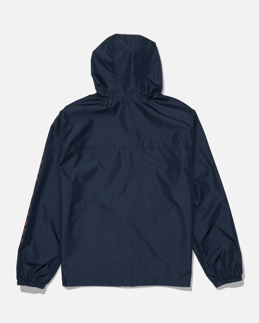 A rear view of the Salty Crew Surface Windbreaker Jacket in navy/orange, showcasing its relaxed fit and elastic cuffs. Made with a hydrophobic polyester shell, this minimalist design features no visible logos or decorations on the back.